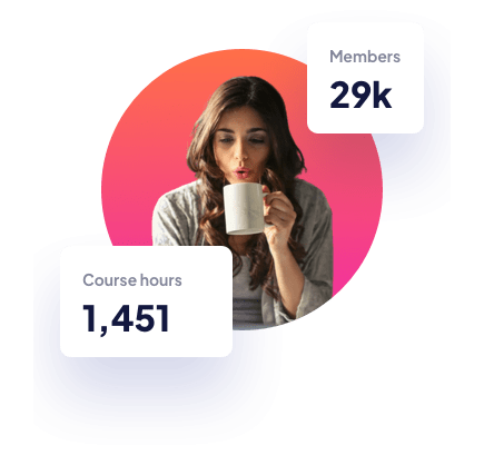A girl with a mug in front of a computer